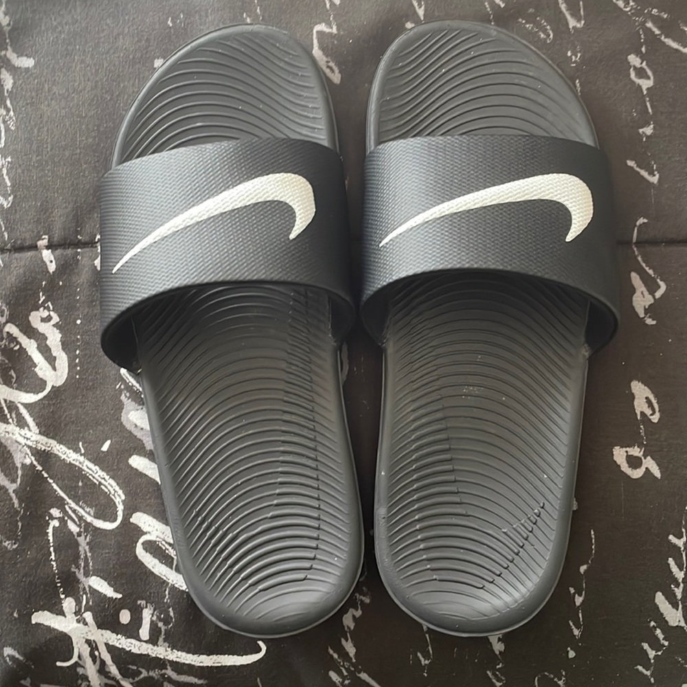 Nike slides.